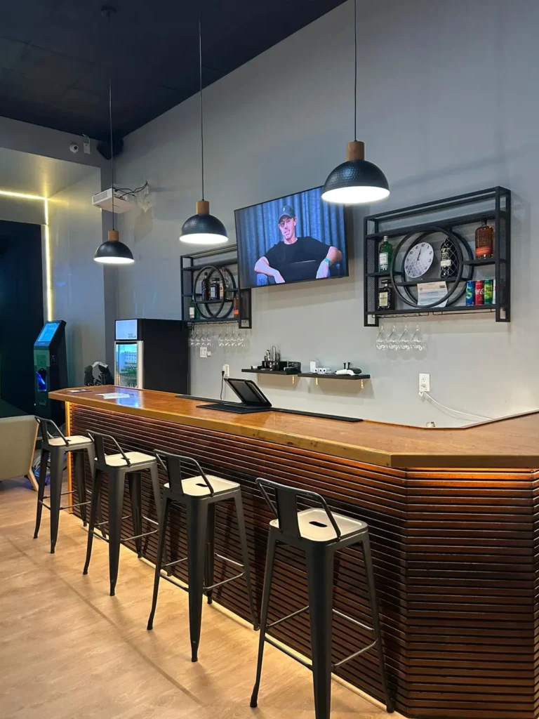 Bar and lounge area at About The Bunker BVI indoor golf venue in Tortola